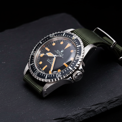 Rolex Submariner side profile on slate